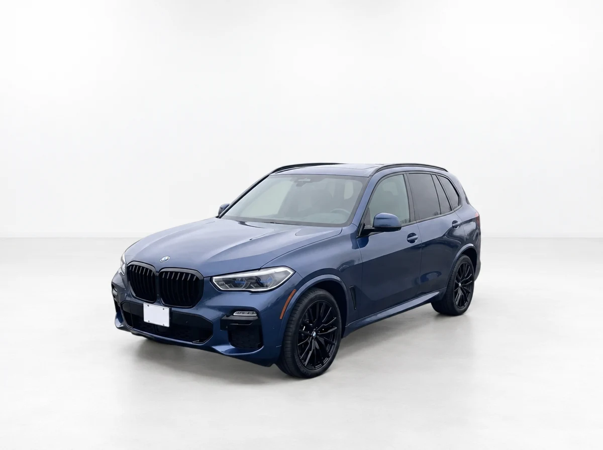 Blue BMW X5 shown in a bright white studio with its original plate