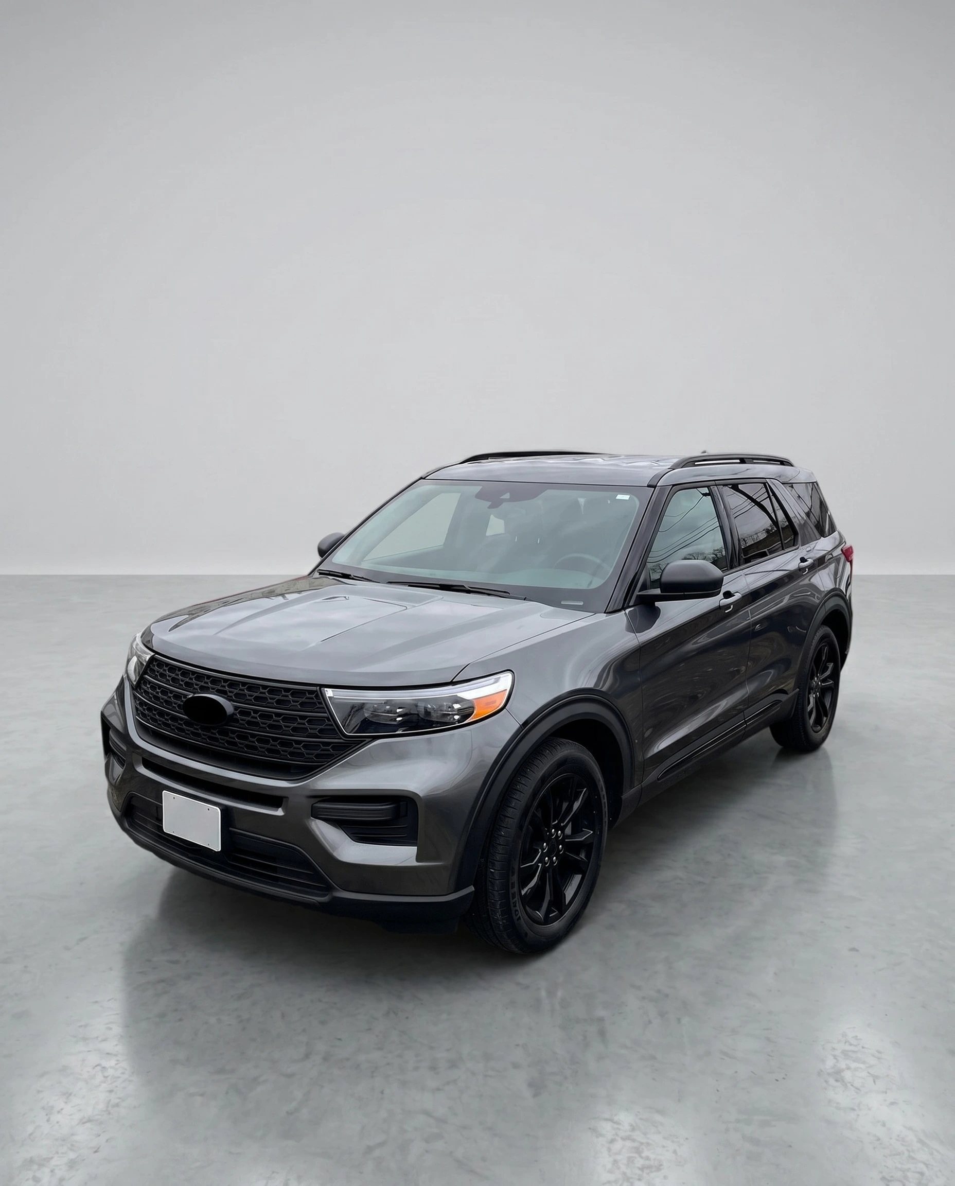 Ford Explorer after CarPixAI background replacement with a clean professional studio-style background